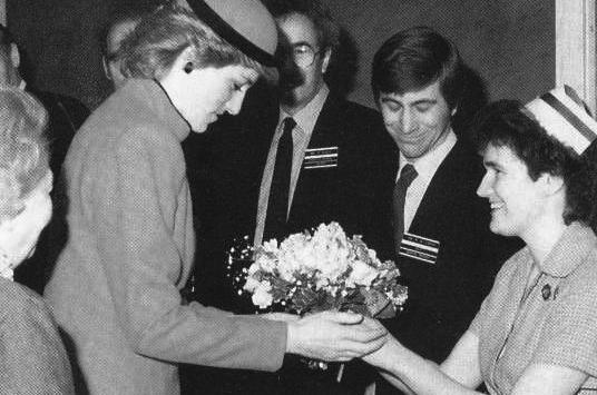 Princess Diana receives flowers from a nurse at Newham Hospital in 1986