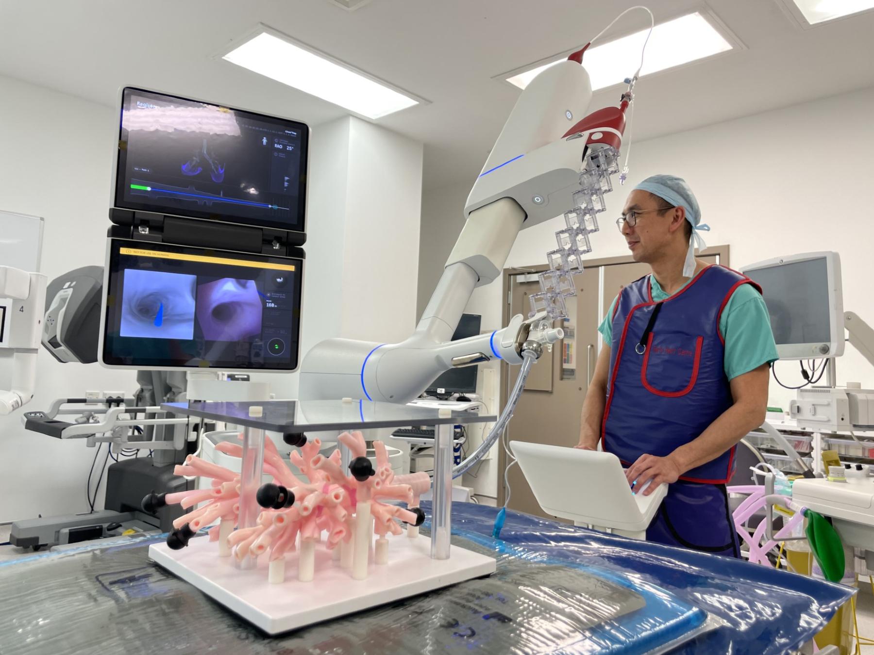 Kelvin Lau demonstrates the Ion technology on a model of the lungs