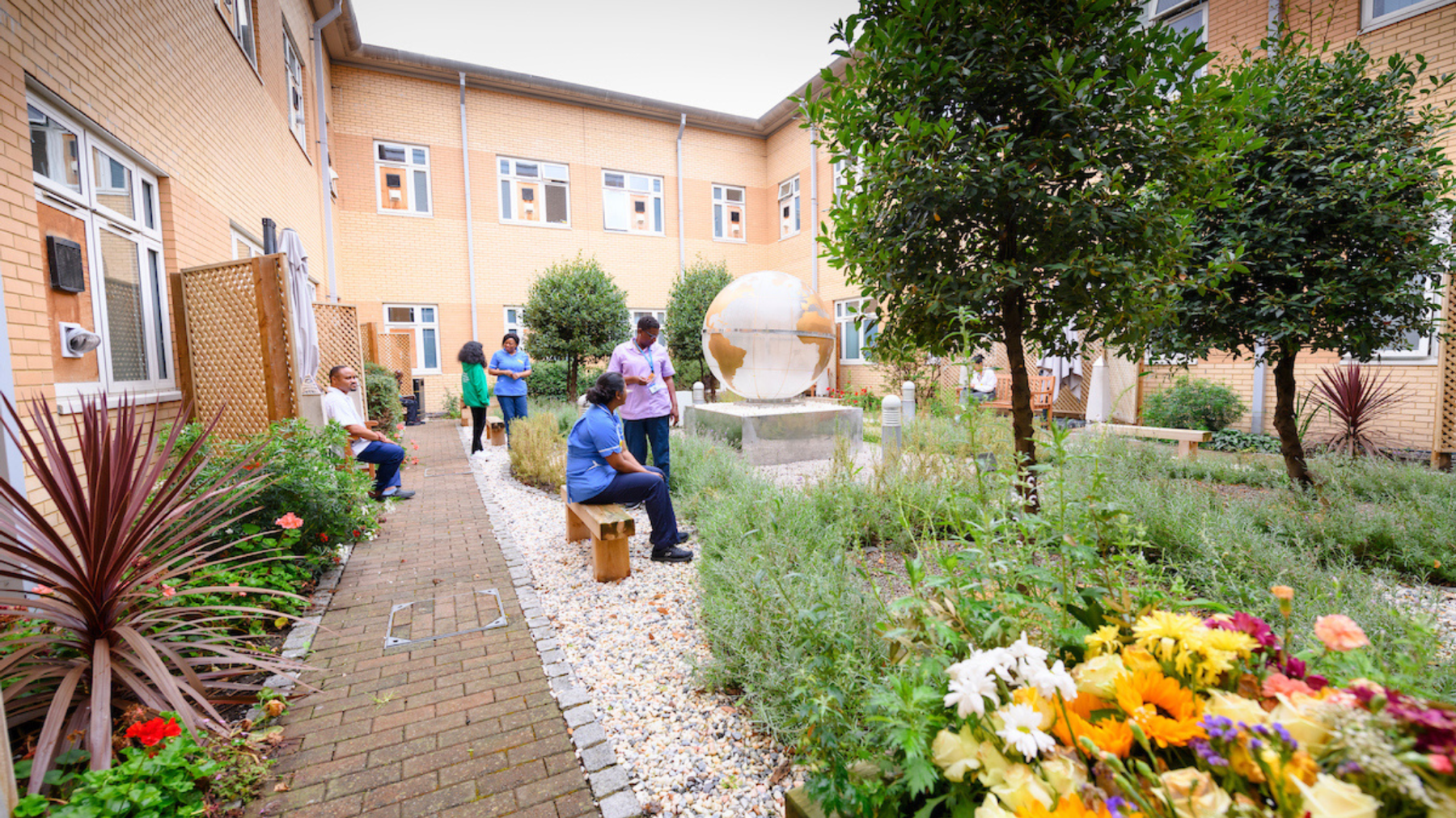A picture of staff enjoying Newham garden space