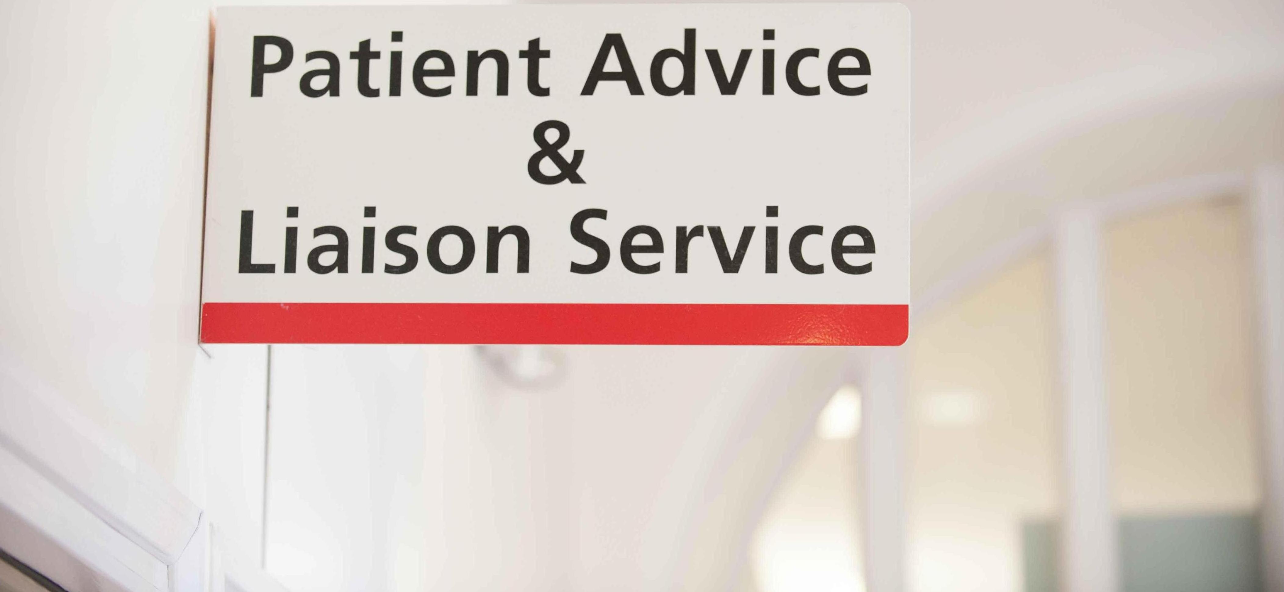 A written sign displaying the patient advice and liaison service