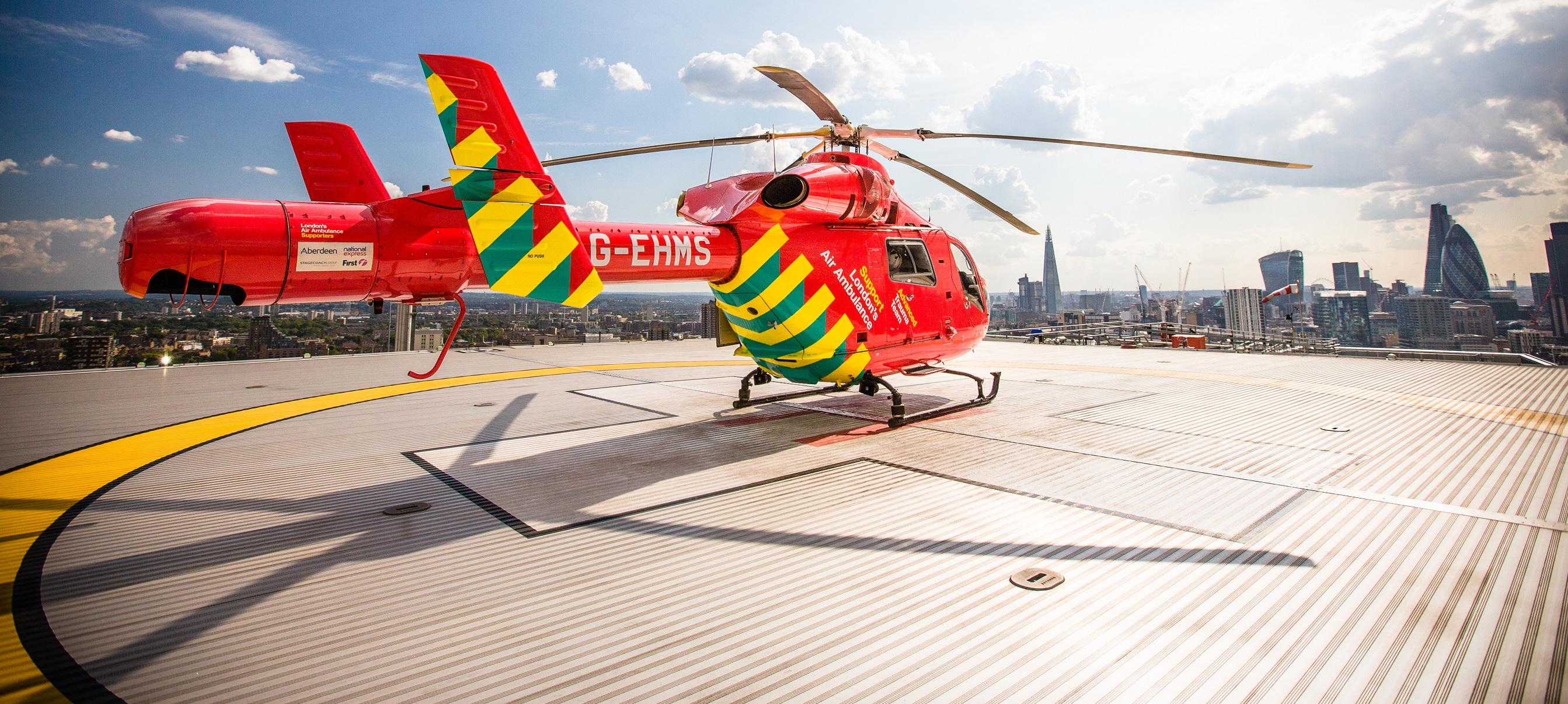 Helicopter at The Royal London Hospital with London skyline
