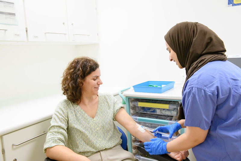 Female patient getting a blood test by healthcare professional